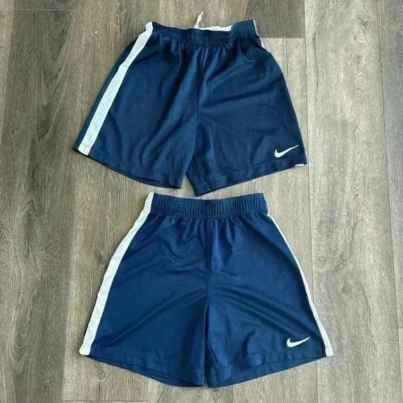 Nike shorts.  Boys size large. Listing is for both pairs.  Both are navy blue. - Picture 1 of 7